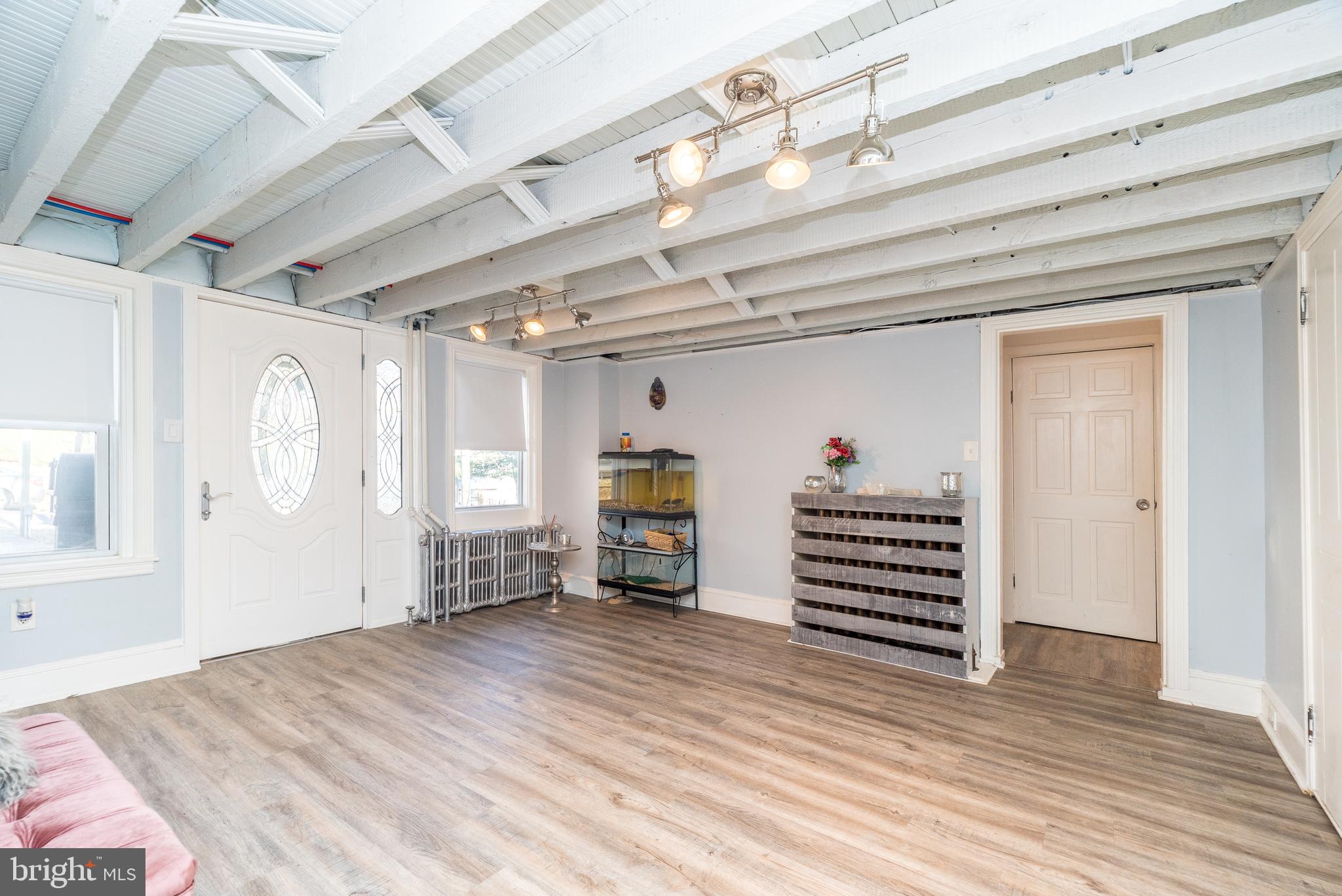 4924 Ridge Avenue Feasterville-Trevose, PA 19053 - Photo 15 of 38 a view of a livingroom with wooden floor and furniture