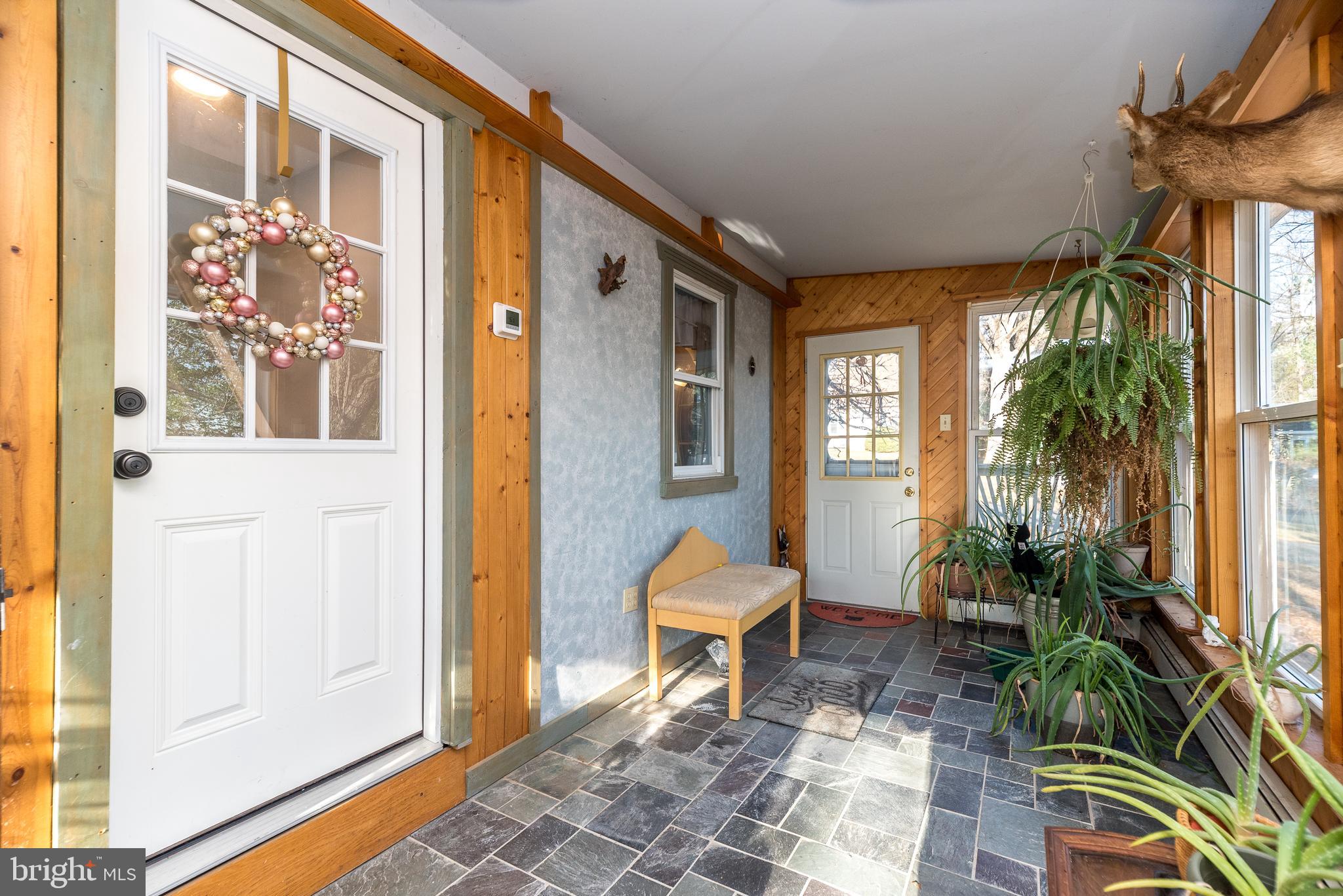 4924 Ridge Avenue Feasterville-Trevose, PA 19053 - Photo 20 of 38 a view of a porch with chairs and potted plants