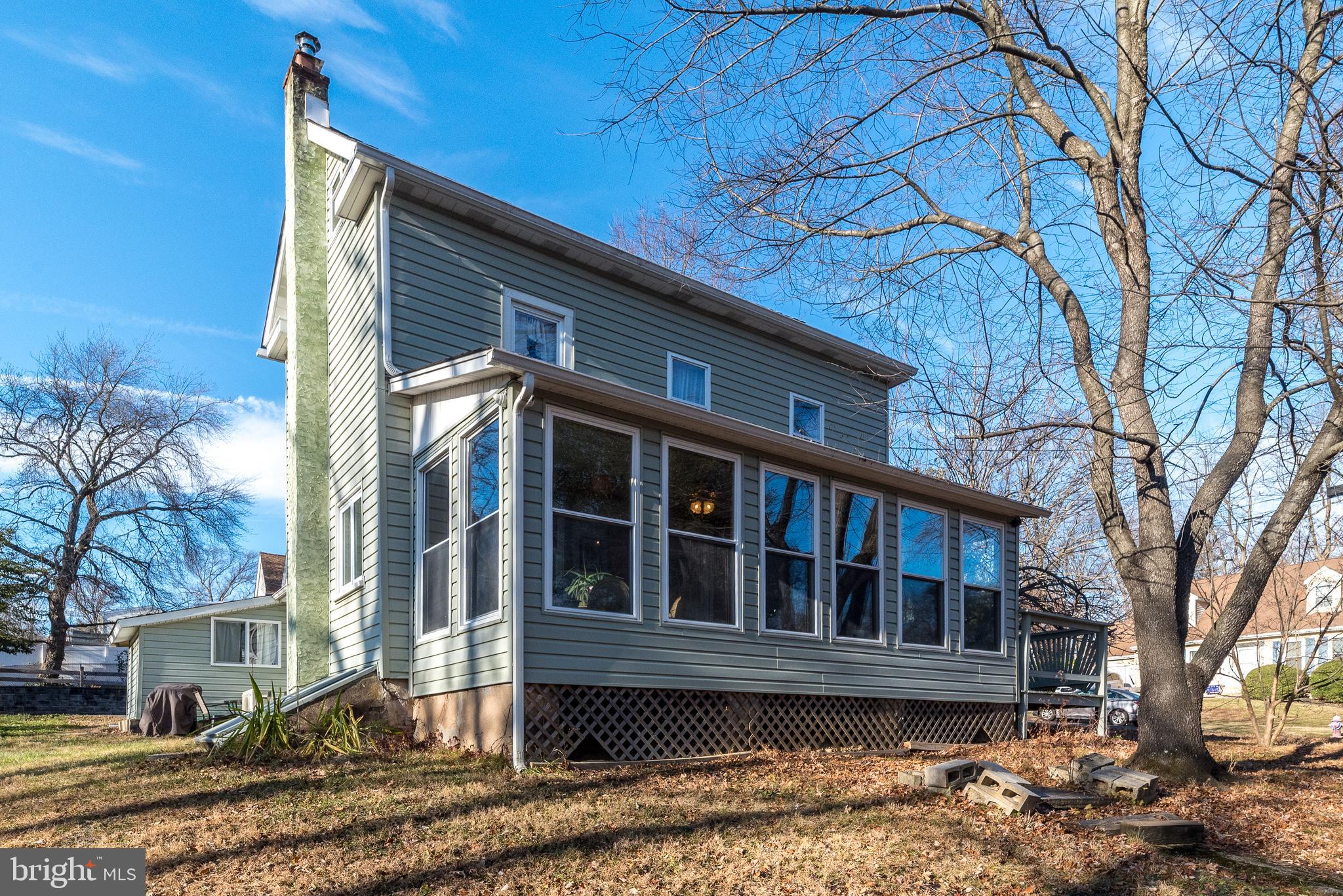 4924 Ridge Avenue Feasterville-Trevose, PA 19053 - Photo 2 of 38 a front view of a house with a yard