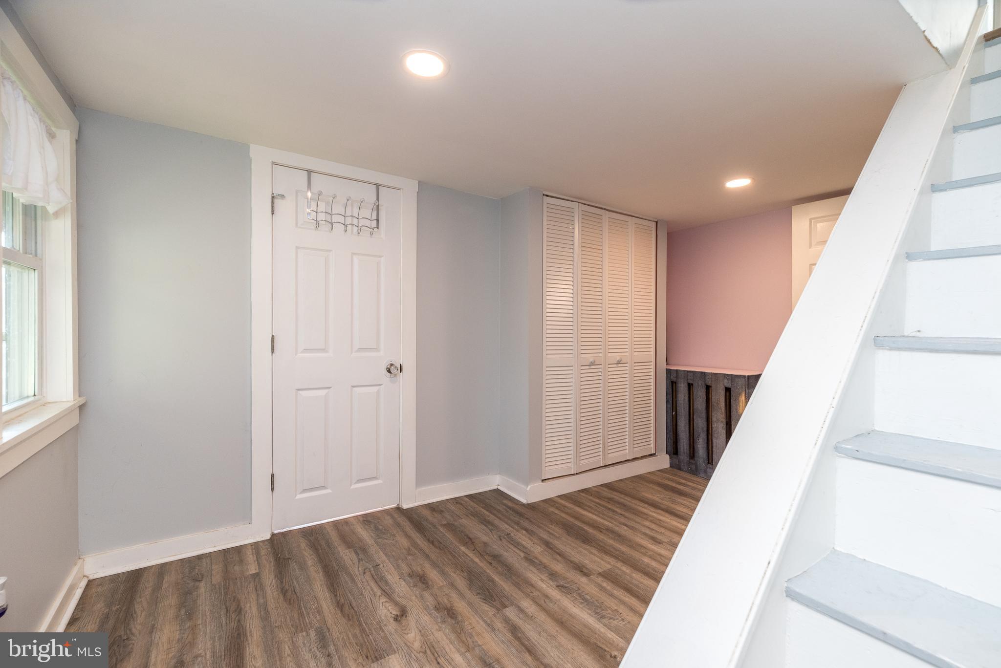 4924 Ridge Avenue Feasterville-Trevose, PA 19053 - Photo 22 of 38 a view of a hallway with wooden floor and staircase
