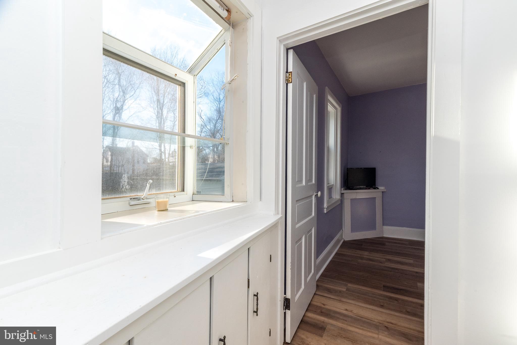 4924 Ridge Avenue Feasterville-Trevose, PA 19053 - Photo 25 of 38 a view of a hallway with wooden floor and cabinets