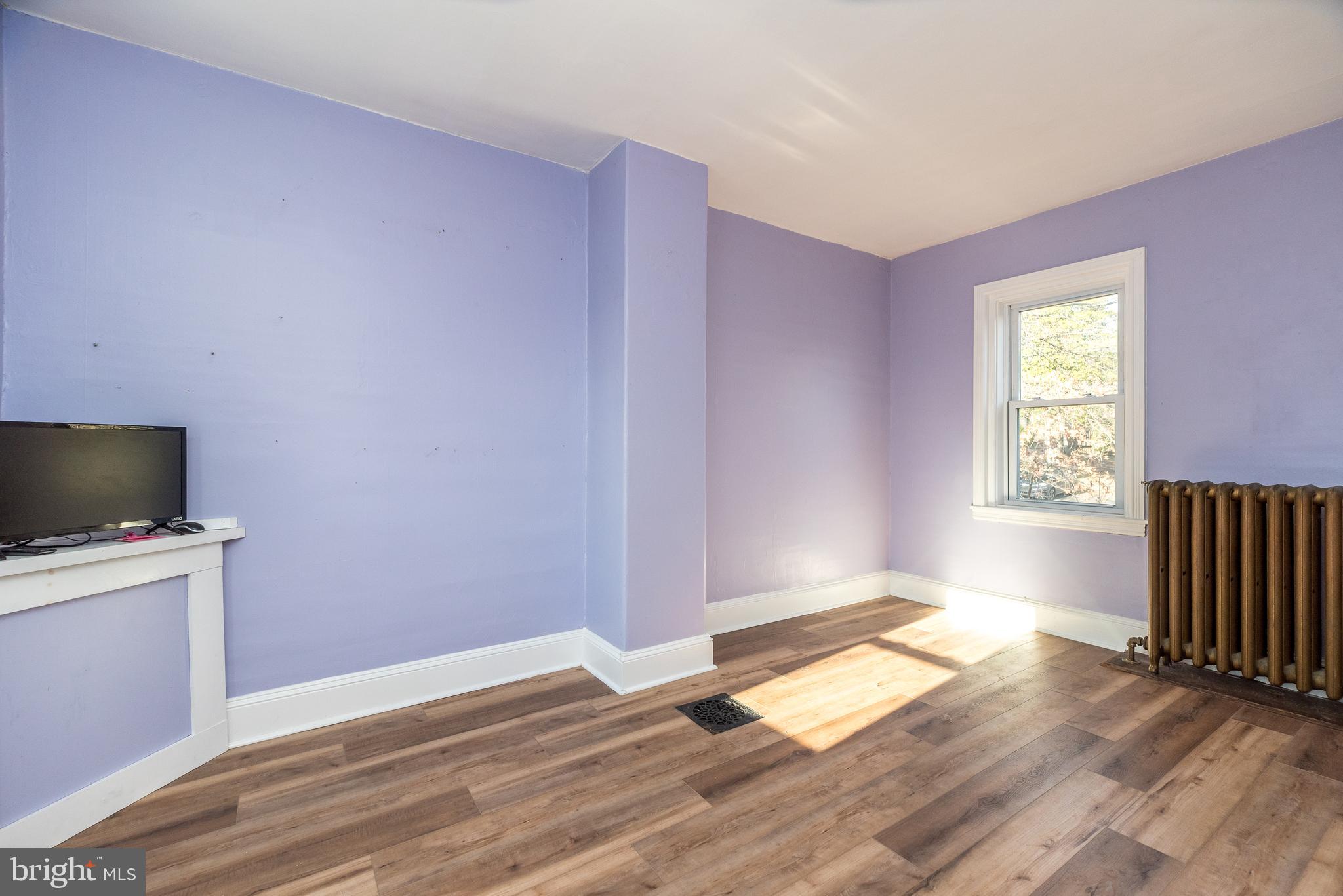 4924 Ridge Avenue Feasterville-Trevose, PA 19053 - Photo 28 of 38 a view of empty room with wooden floor and fan