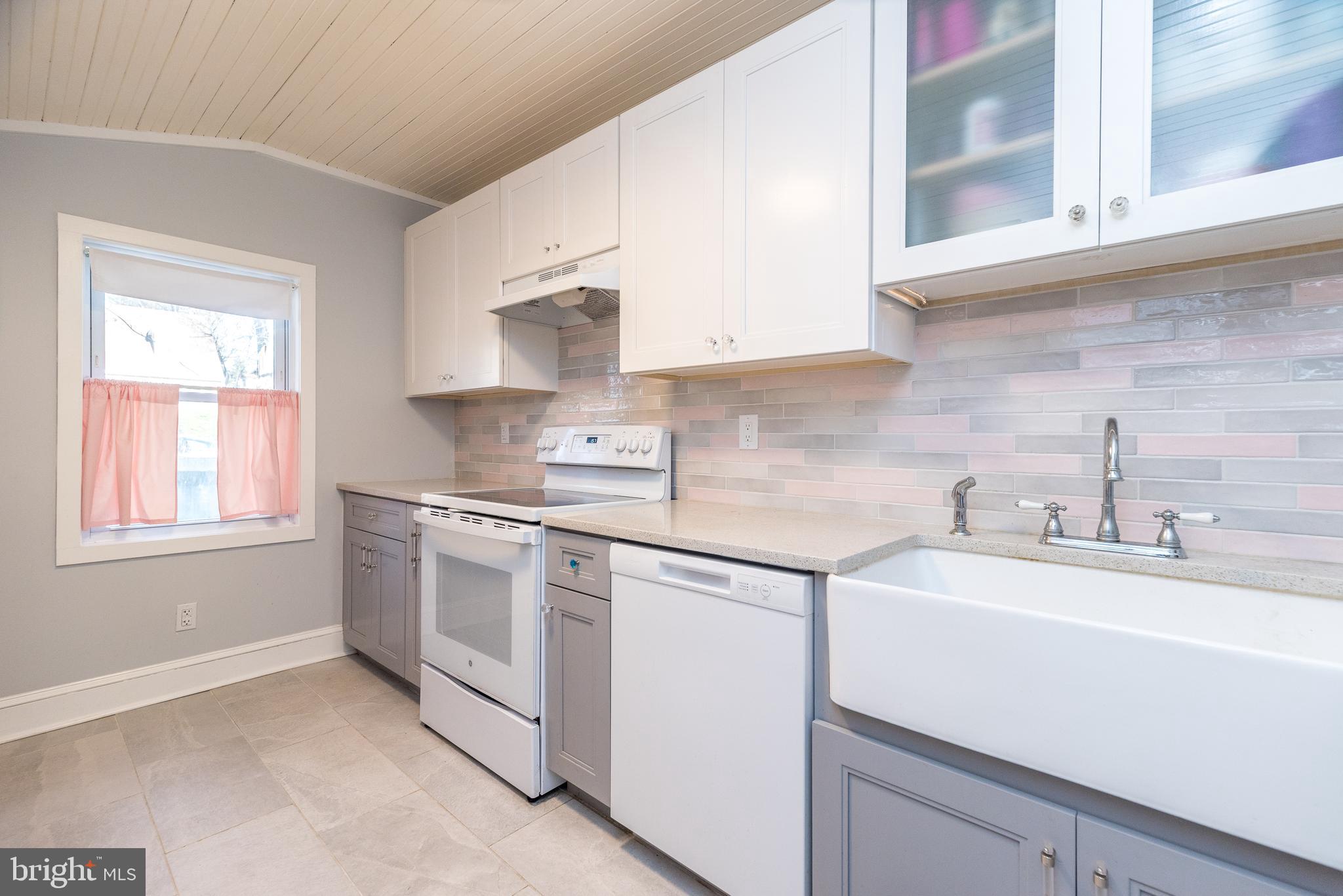 4924 Ridge Avenue Feasterville-Trevose, PA 19053 - Photo 10 of 38 a kitchen with stainless steel appliances granite countertop a sink and a stove