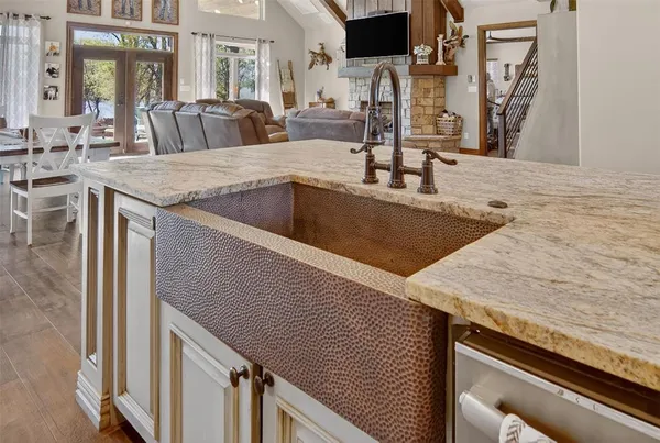 a kitchen with a sink and a refrigerator