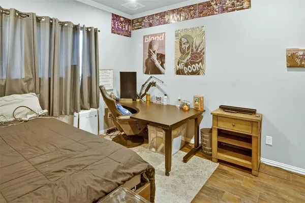 a bedroom with bed and a window