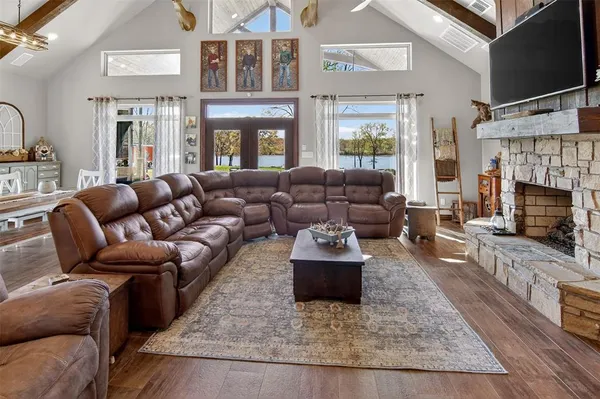 a living room with furniture fireplace and a flat screen tv