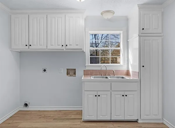 a view of cabinets with wooden floor