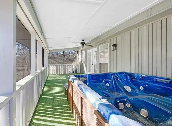 a view of a porch with wooden floor