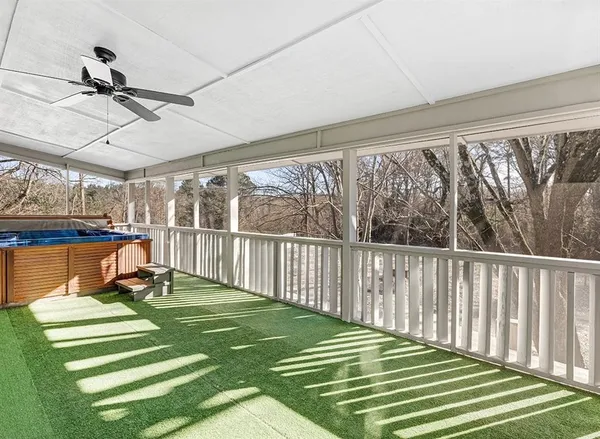 a view of a swimming pool with a yard