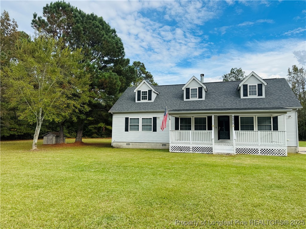 7572 Dunn Road Godwin, NC 28344 - Photo 2 of 3 a front view of a house with a yard