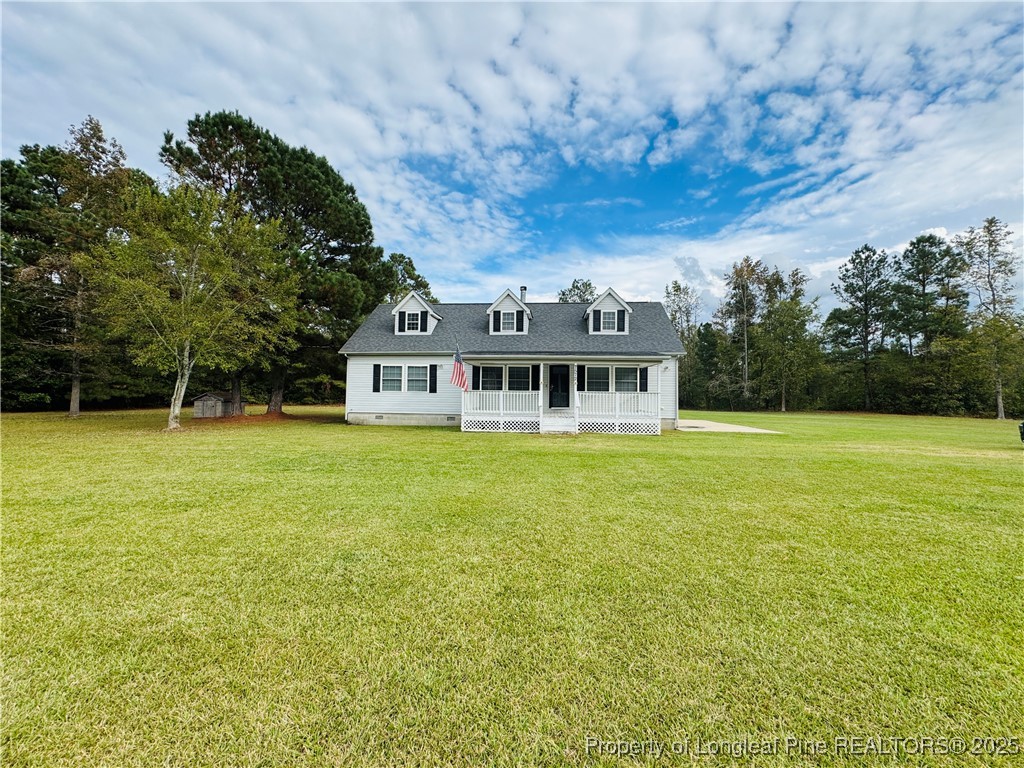 7572 Dunn Road Godwin, NC 28344 - Photo 3 of 3 a front view of house with yard and seating