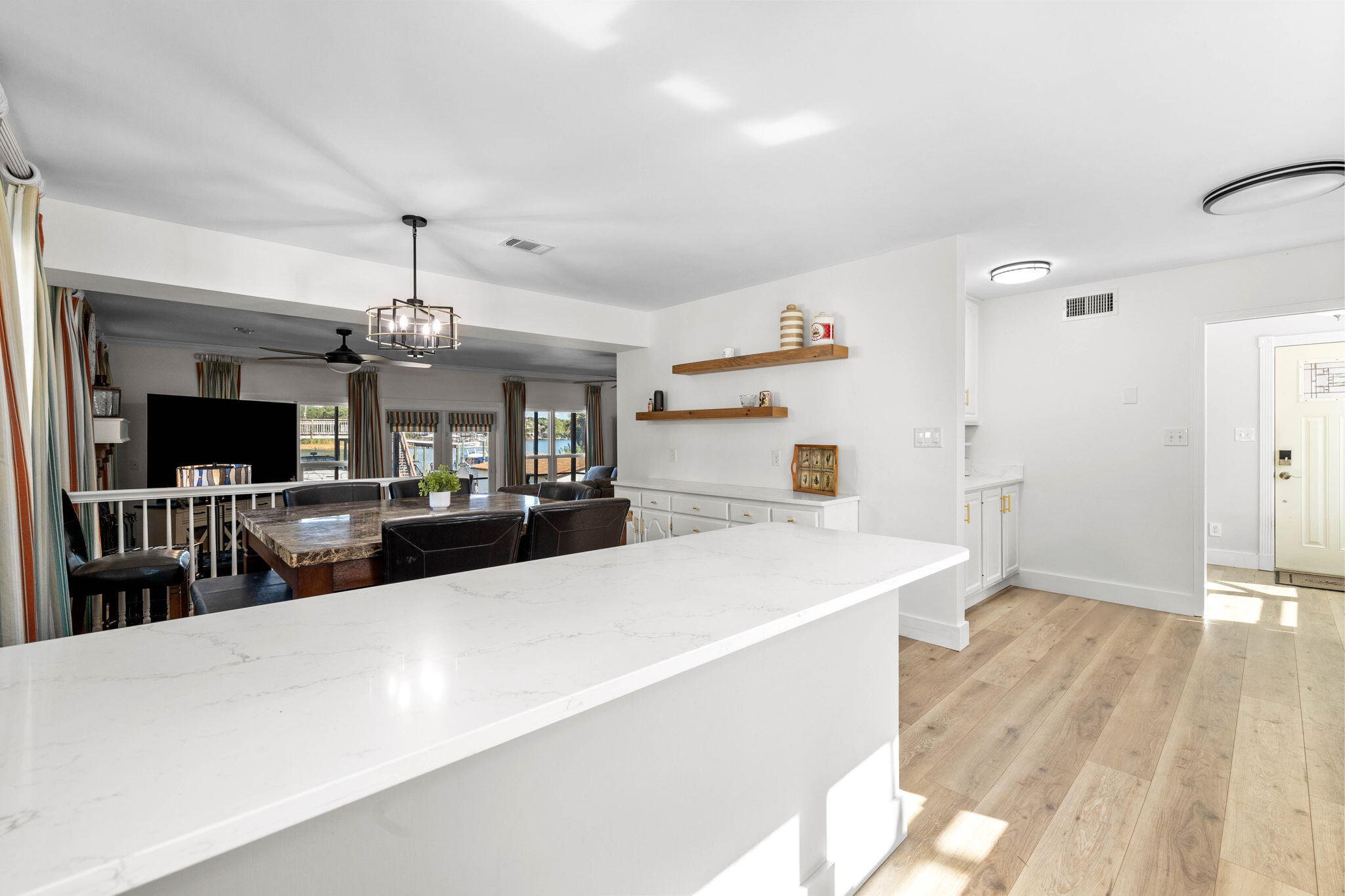 710 Beach Drive Destin, FL 32541 - Photo 14 of 64 a large white kitchen with a large counter top and refrigerator