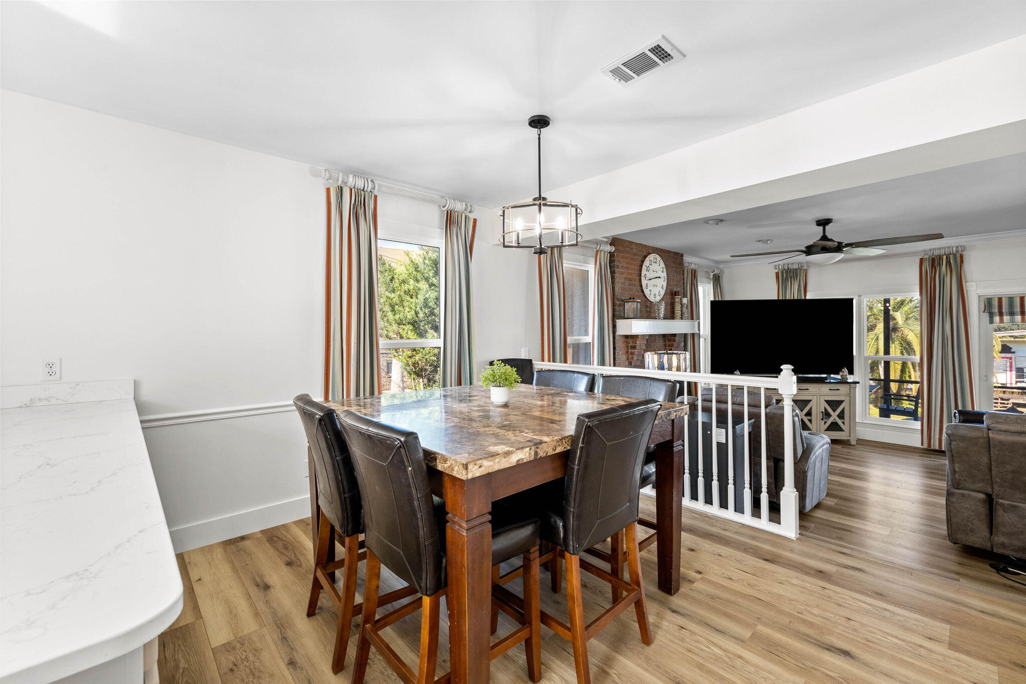 710 Beach Drive Destin, FL 32541 - Photo 17 of 64 a view of a dining room with furniture window and wooden floor