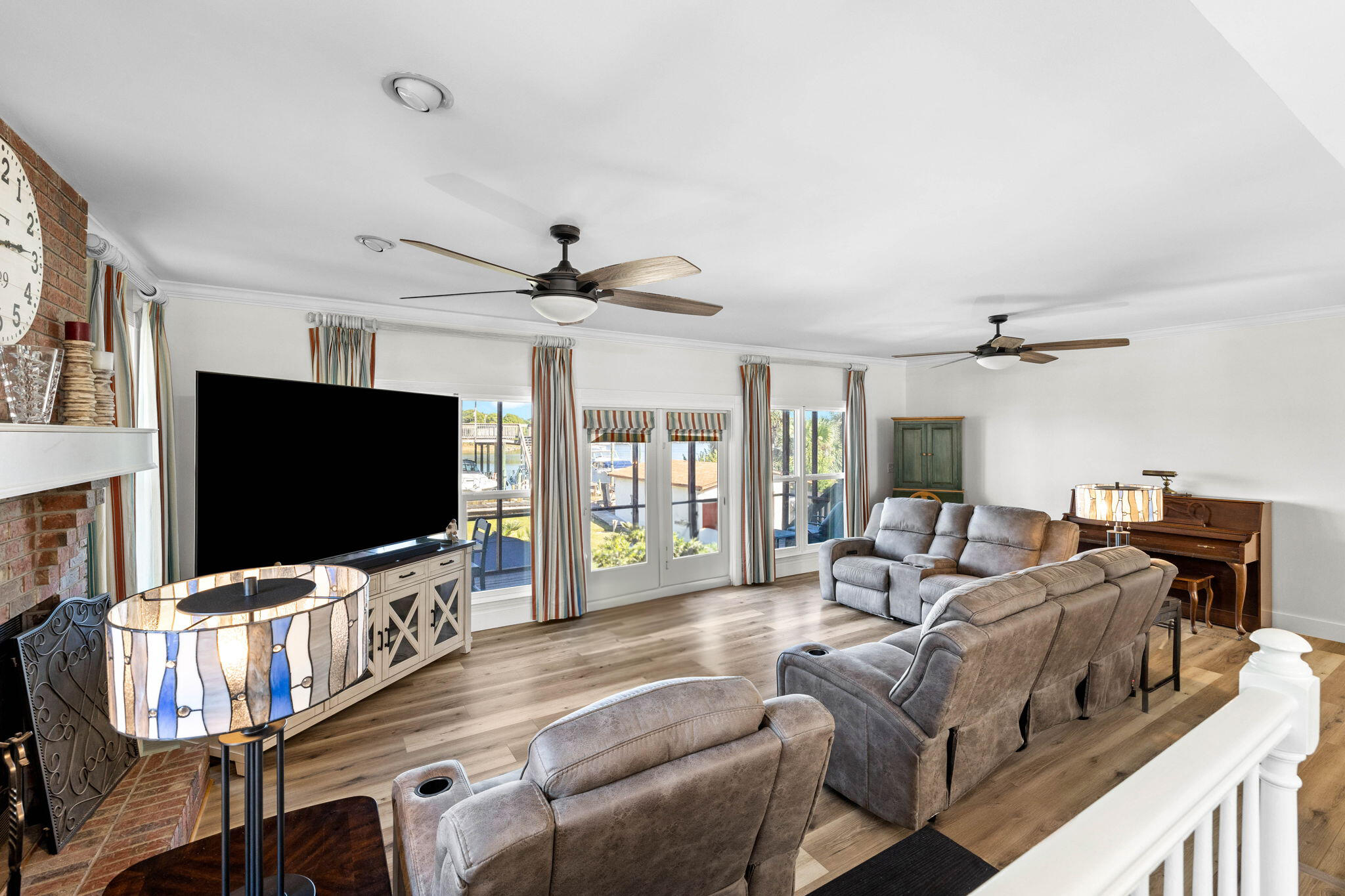 710 Beach Drive Destin, FL 32541 - Photo 18 of 64 a living room with furniture and a flat screen tv