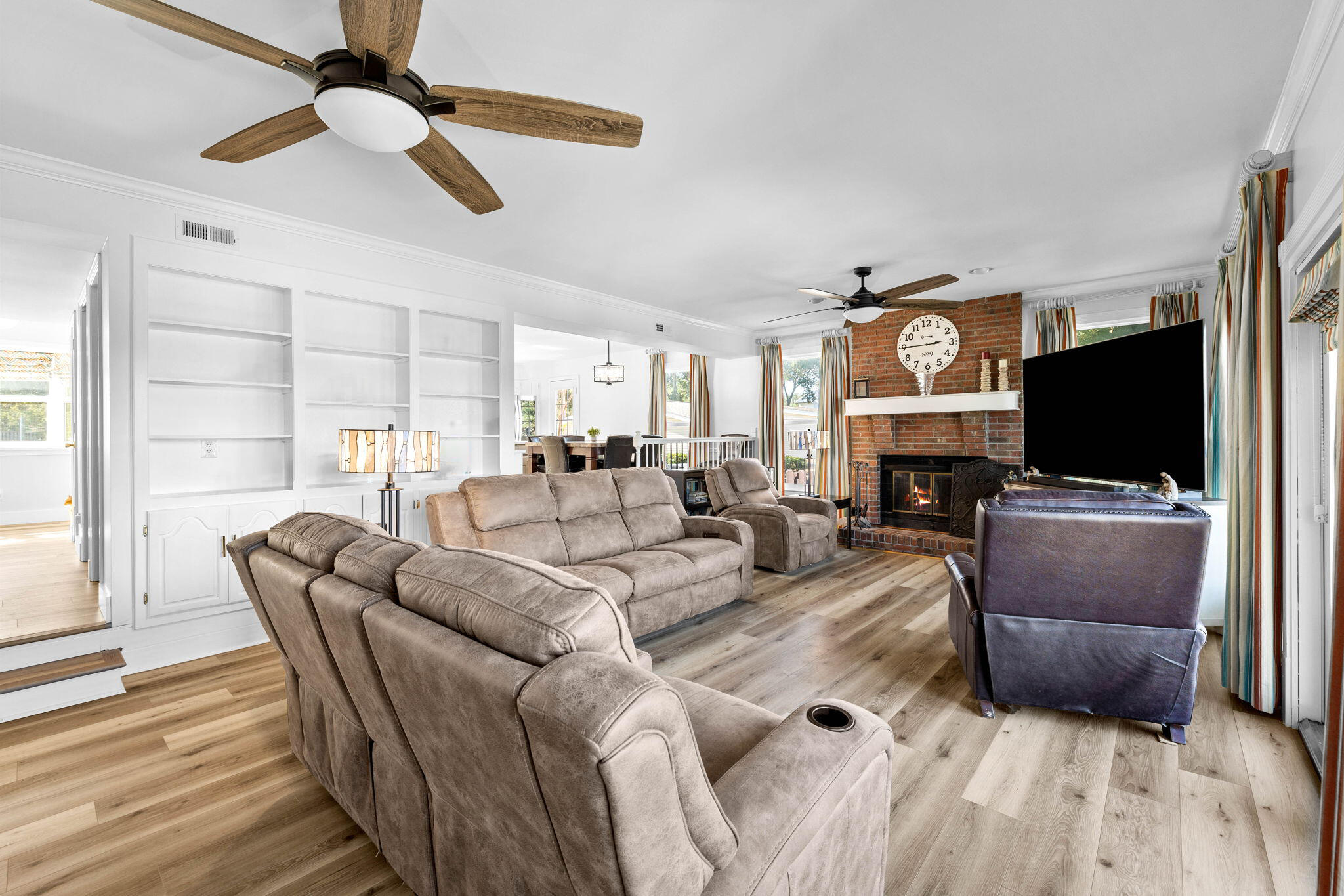 710 Beach Drive Destin, FL 32541 - Photo 20 of 64 a living room with furniture a flat screen tv and a fireplace