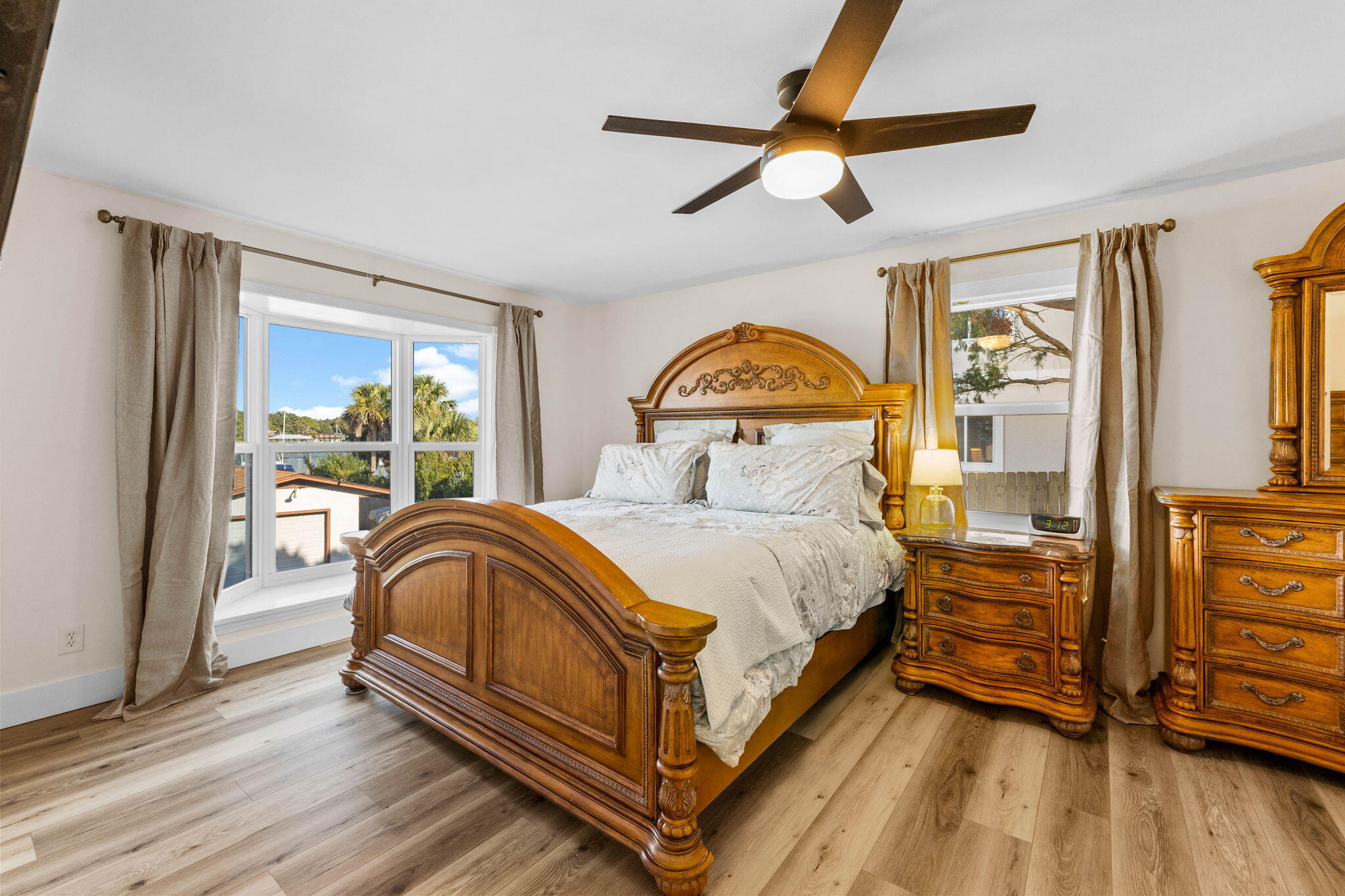 710 Beach Drive Destin, FL 32541 - Photo 24 of 64 a bedroom with a bed and wooden floor