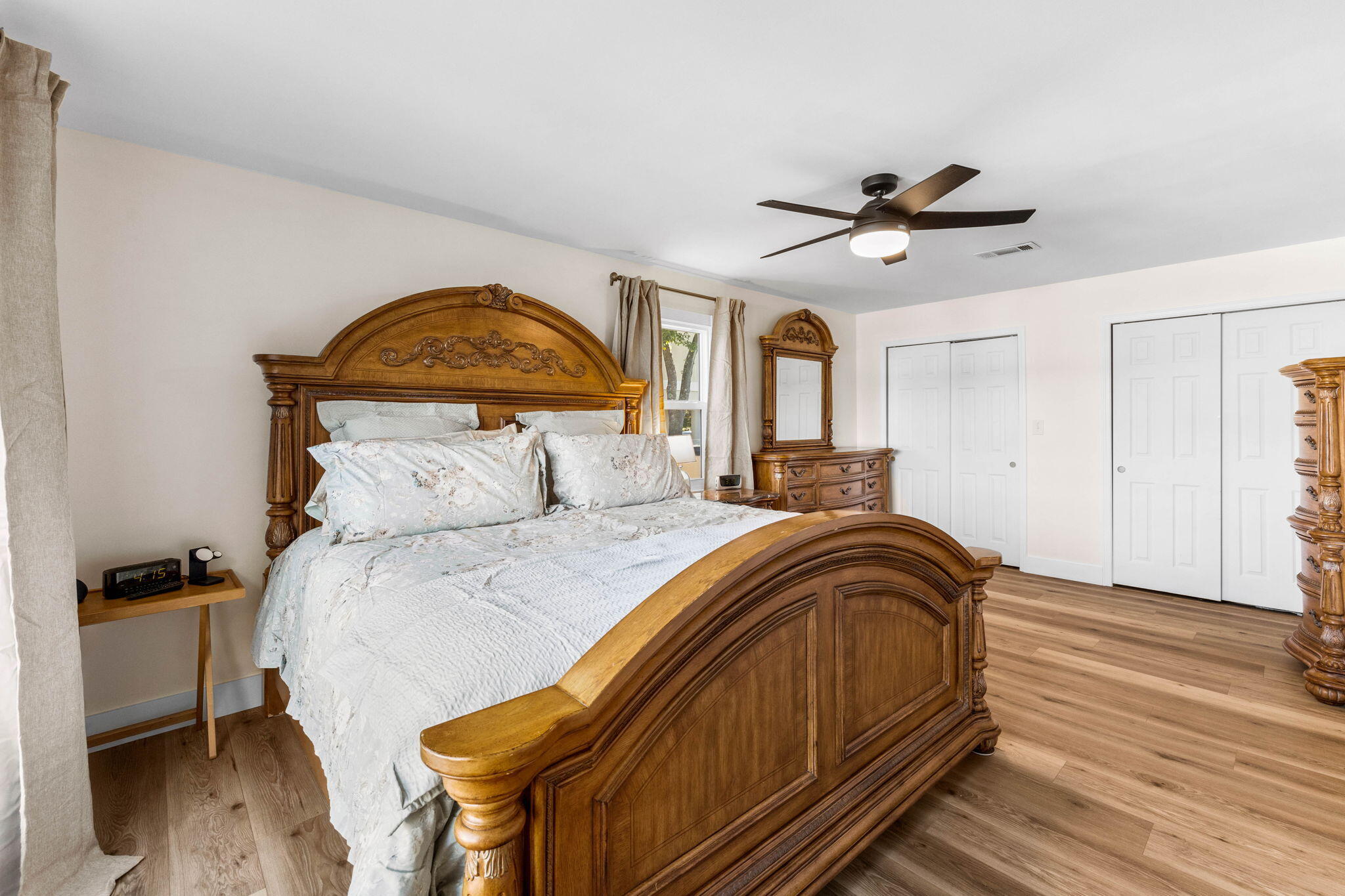 710 Beach Drive Destin, FL 32541 - Photo 25 of 64 a bedroom with a bed and wooden floor
