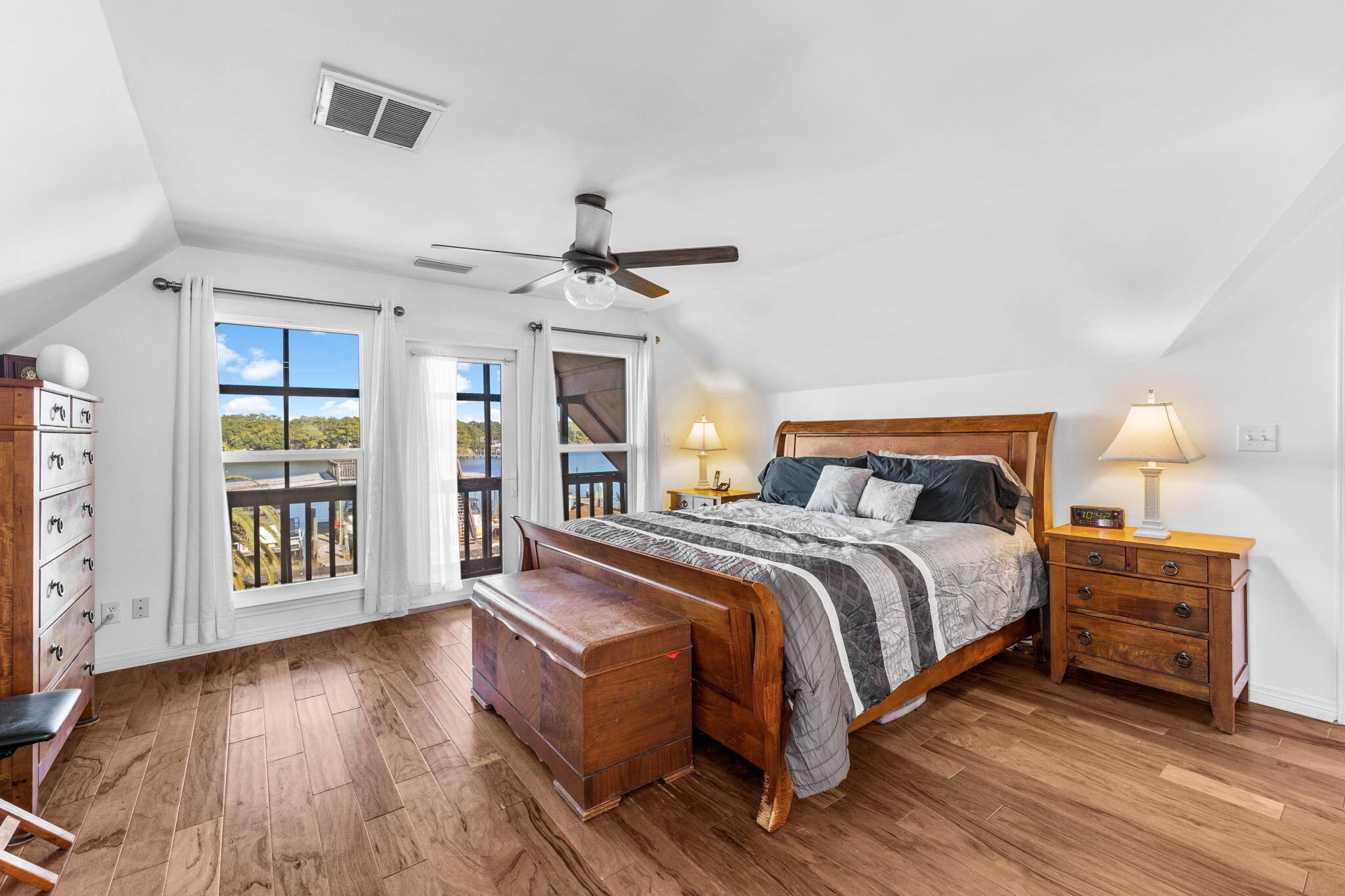 710 Beach Drive Destin, FL 32541 - Photo 28 of 64 a bedroom with a bed and wooden floor