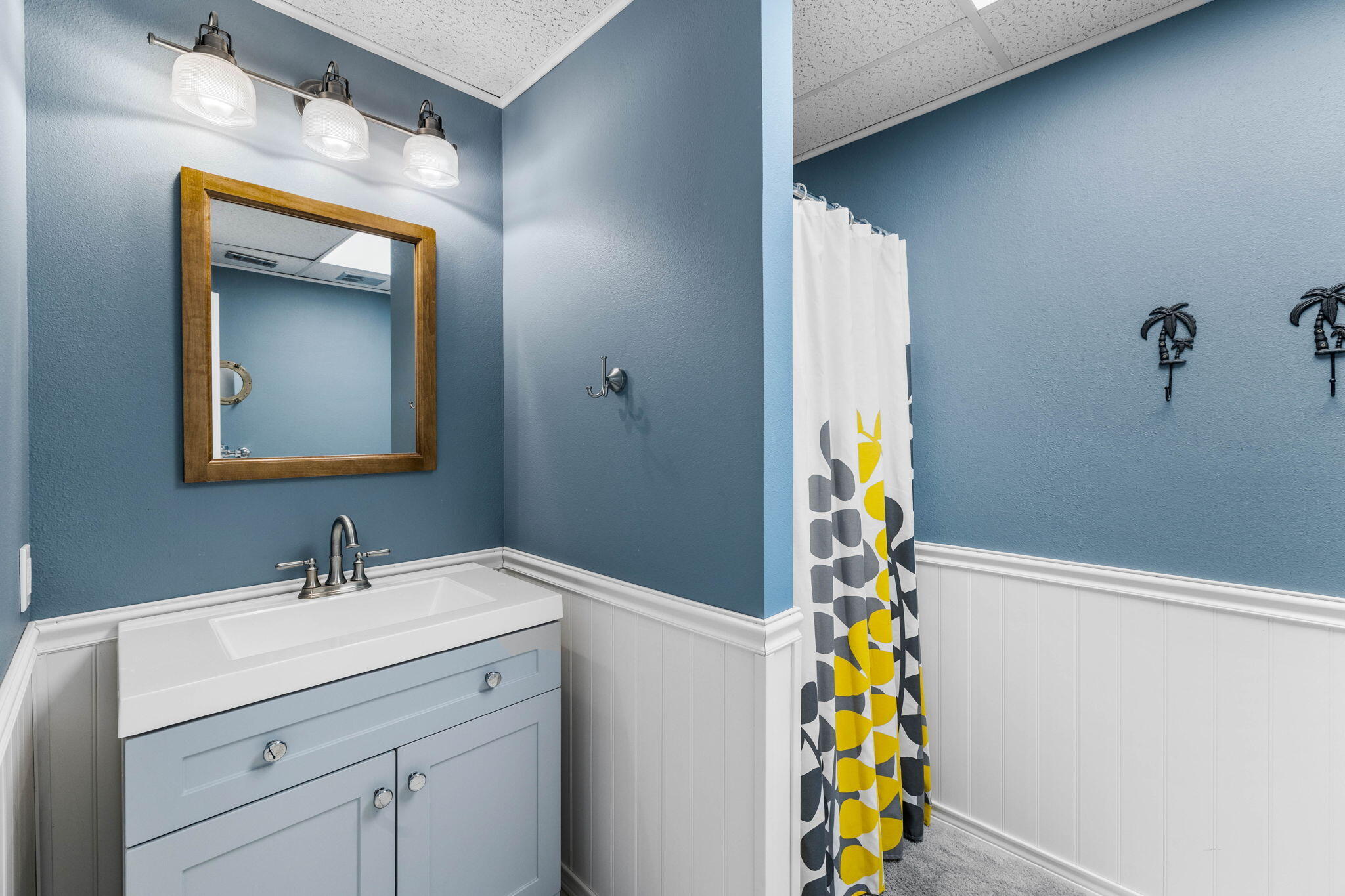 710 Beach Drive Destin, FL 32541 - Photo 38 of 64 a bathroom with a sink and a mirror