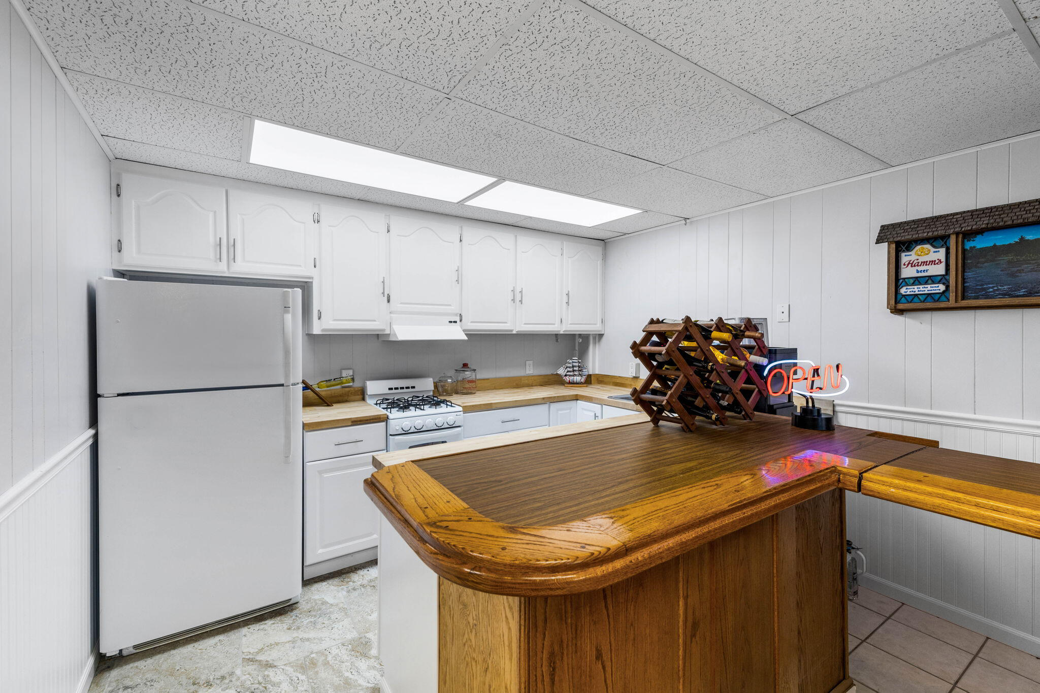 710 Beach Drive Destin, FL 32541 - Photo 40 of 64 a kitchen with stainless steel appliances granite countertop a sink a refrigerator and a stove