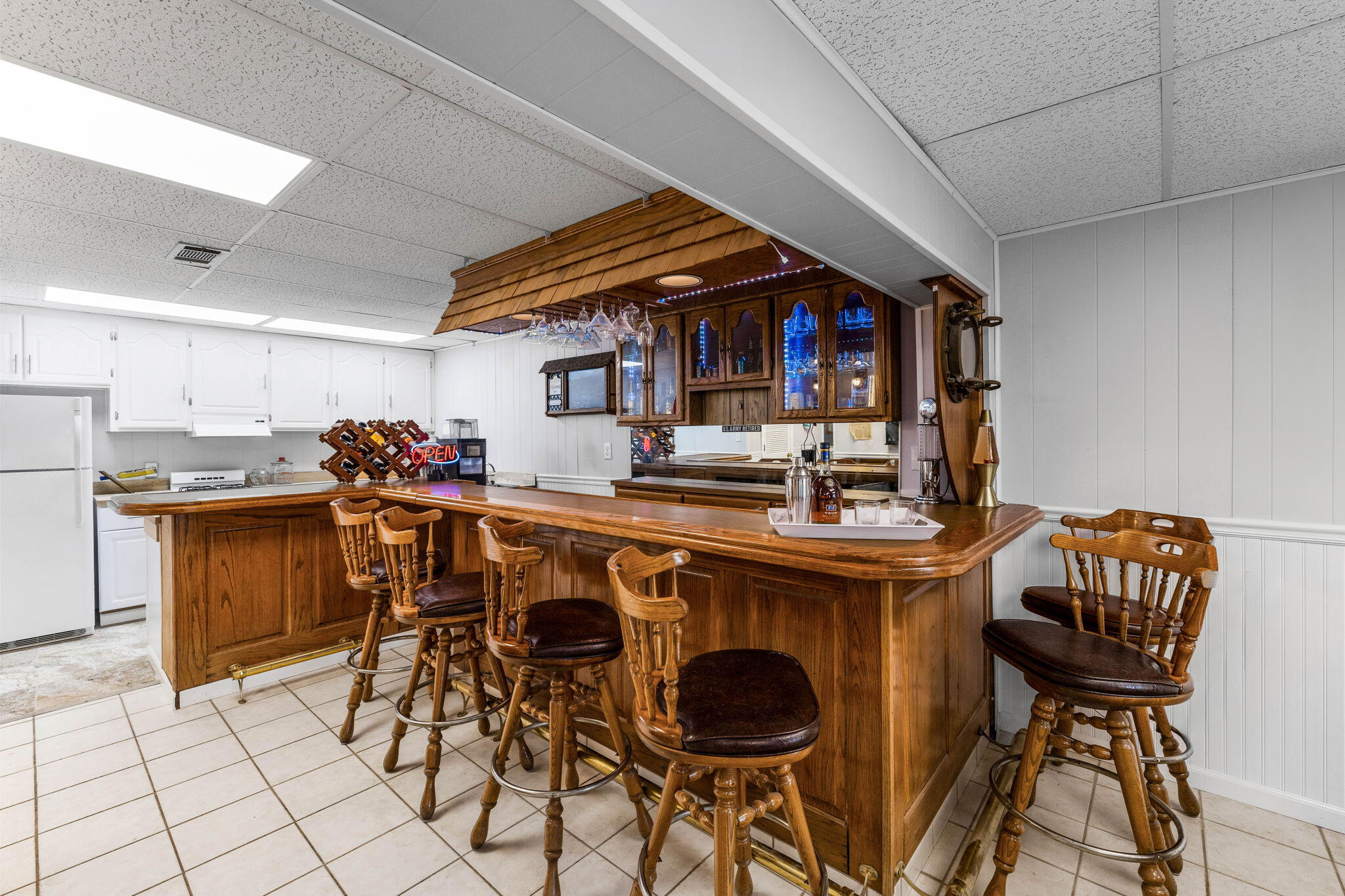 710 Beach Drive Destin, FL 32541 - Photo 41 of 64 a kitchen with stainless steel appliances kitchen island granite countertop a table chairs and a refrigerator