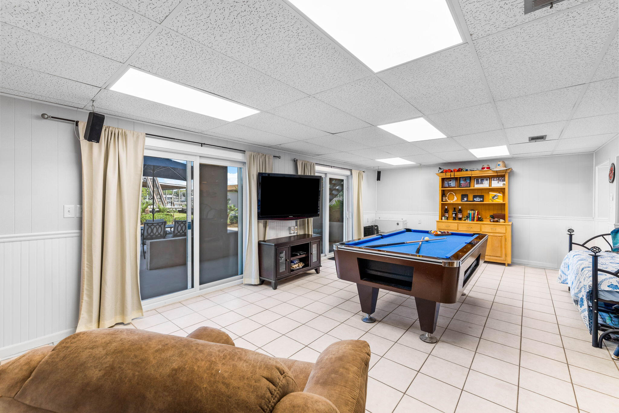 710 Beach Drive Destin, FL 32541 - Photo 42 of 64 a living room with furniture and a flat screen tv