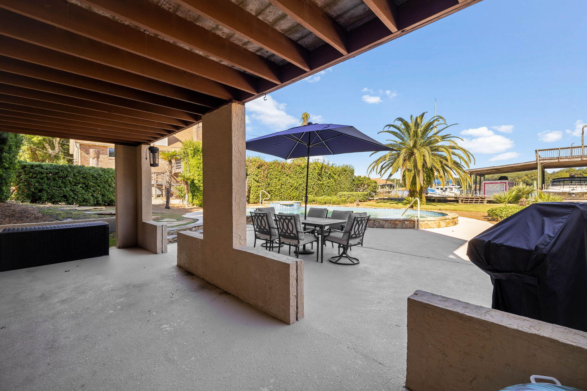 710 Beach Drive Destin, FL 32541 - Photo 45 of 64 a view of a swimming pool with a patio