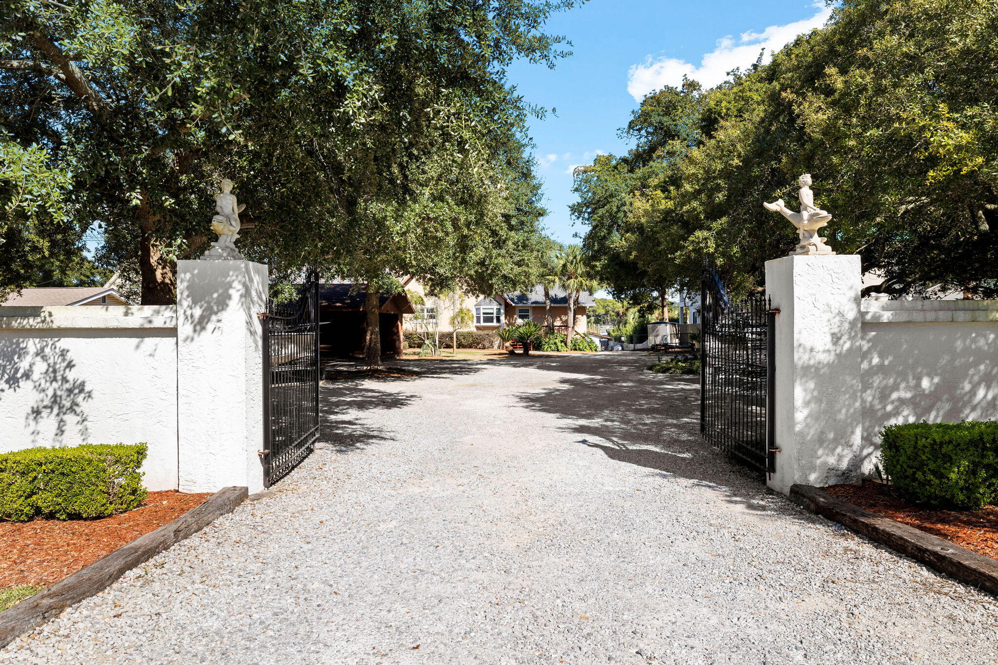 710 Beach Drive Destin, FL 32541 - Photo 6 of 64 a street view with large trees