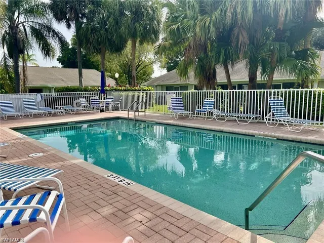 a view of a swimming pool with a patio