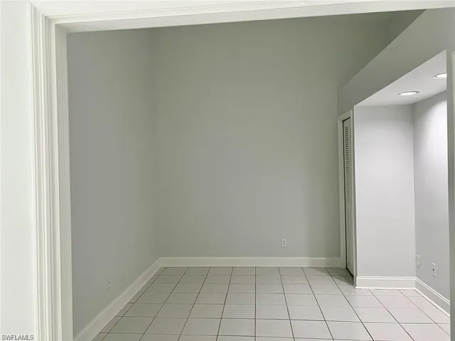 an empty room with white door