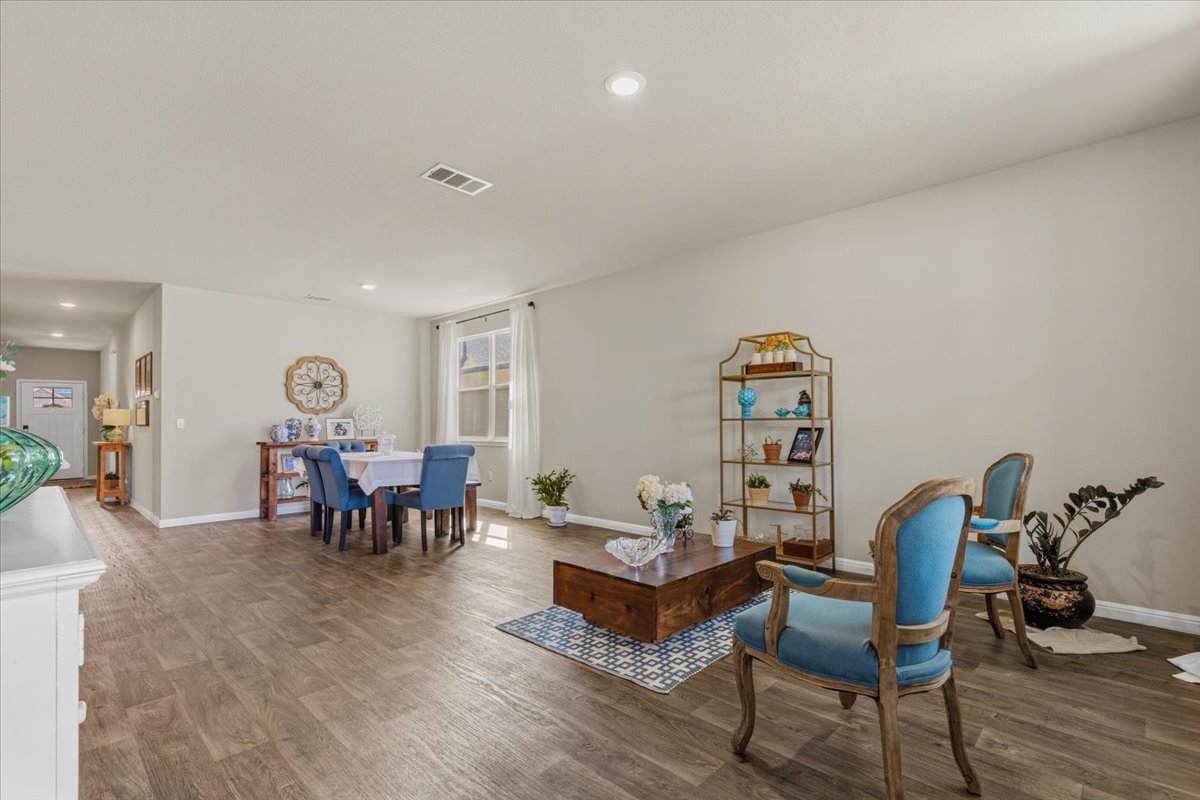 112 Rainmaker Cove Bastrop, TX 78602 - Photo 11 of 34 Sitting room with wood finished floors and recessed lighting