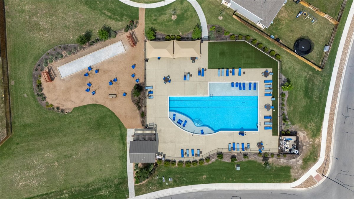 112 Rainmaker Cove Bastrop, TX 78602 - Photo 30 of 34 Bird's eye view of a pool area
