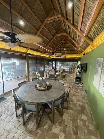 a view of outdoor space with table and chairs