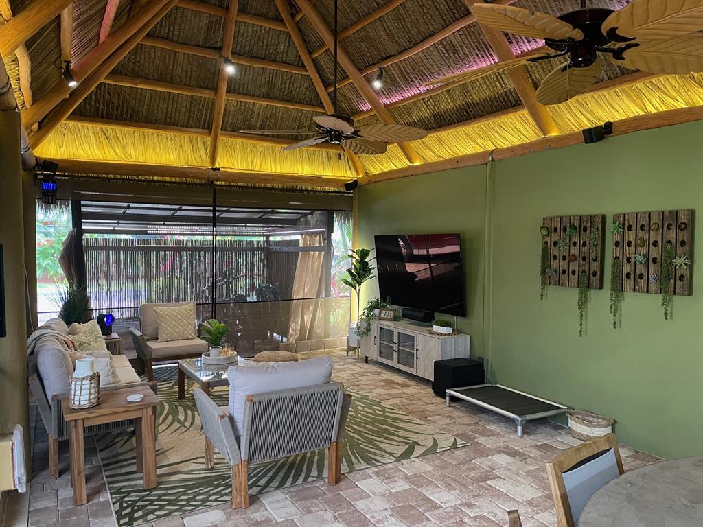 368 Sundial Circle, Unit 368 Margate, FL 33068 - Photo 4 of 13 a view of a backyard with table and chairs under an umbrella