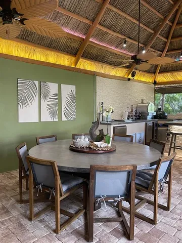 a view of a dining room with furniture and window