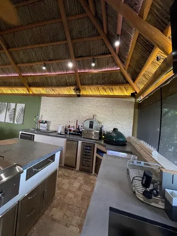 a kitchen with stove and cabinets