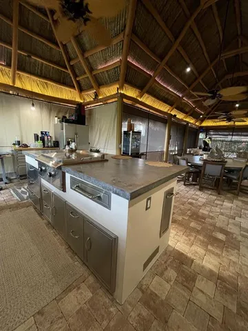 a view of a kitchen with storage and utility