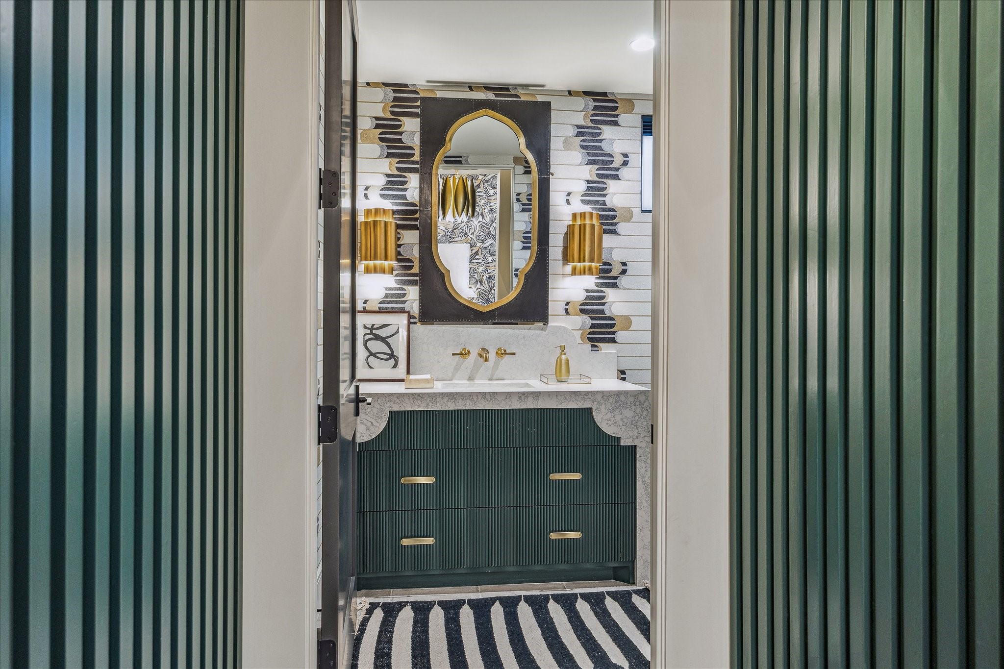 3807 Westerman Street Houston, TX 77005 - Photo 22 of 50 The first-floor powder room, designed by Cassandra Brand Interiors, is framed by custom paneled walls that create an elegant and timeless ambiance.