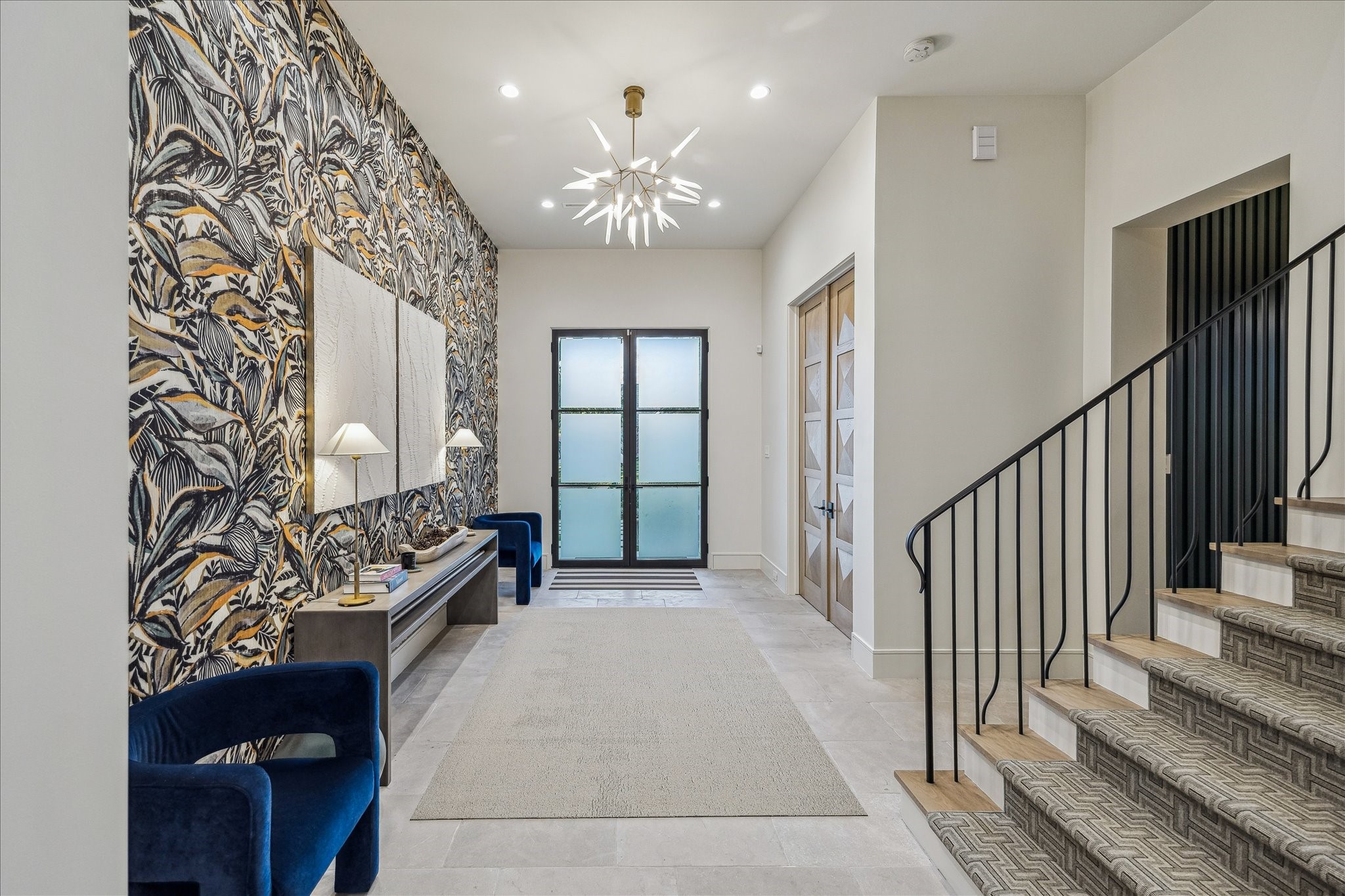 3807 Westerman Street Houston, TX 77005 - Photo 24 of 50 This grand entry offers seamless access to the sophisticated study and the sweeping staircase beyond, creating a perfect introduction to the home’s elegant design and thoughtful flow.