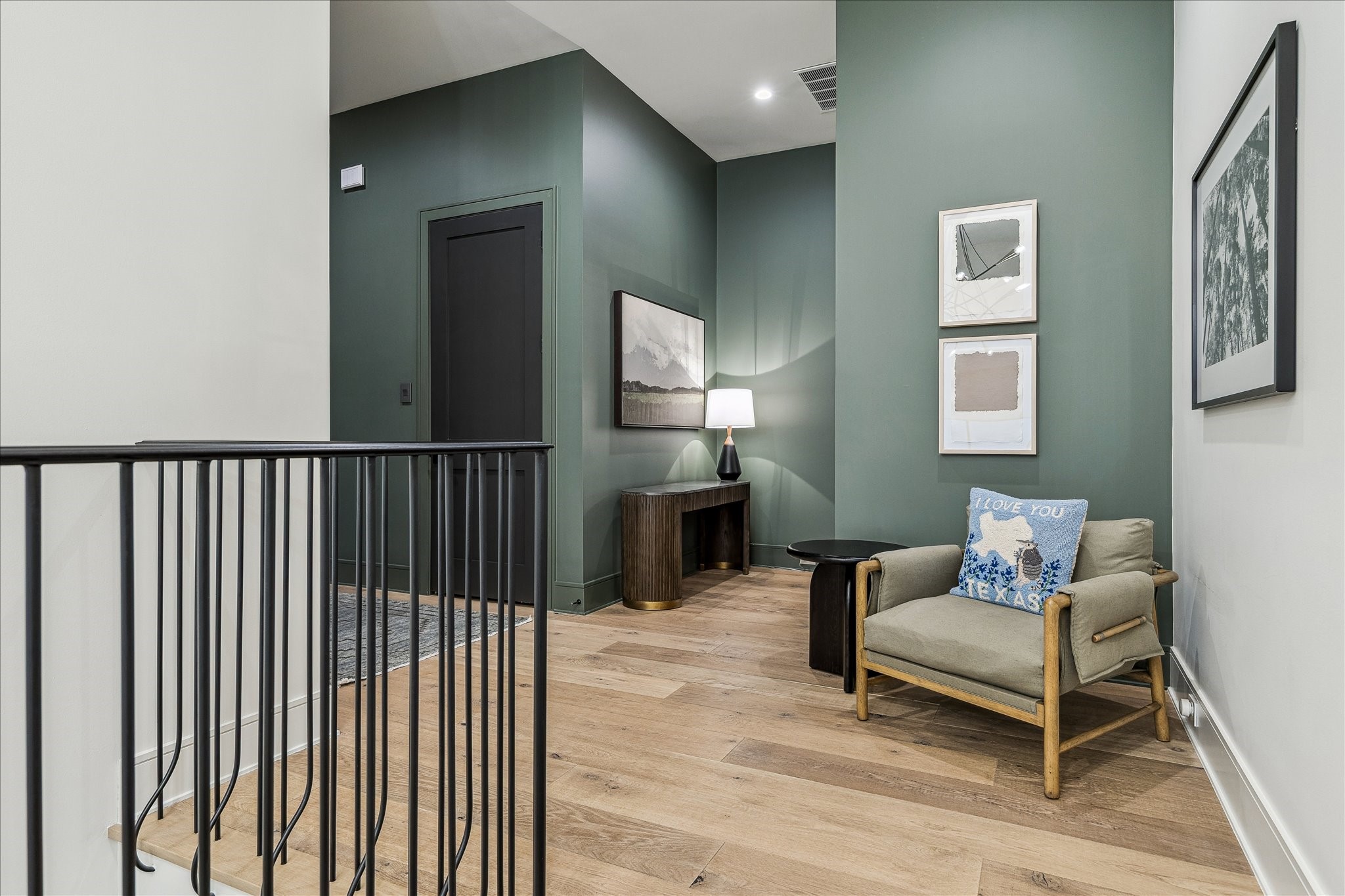 3807 Westerman Street Houston, TX 77005 - Photo 26 of 50 The stair hall landing features white oak flooring and designer wall paint, creating a stylish and cohesive transition between levels.
