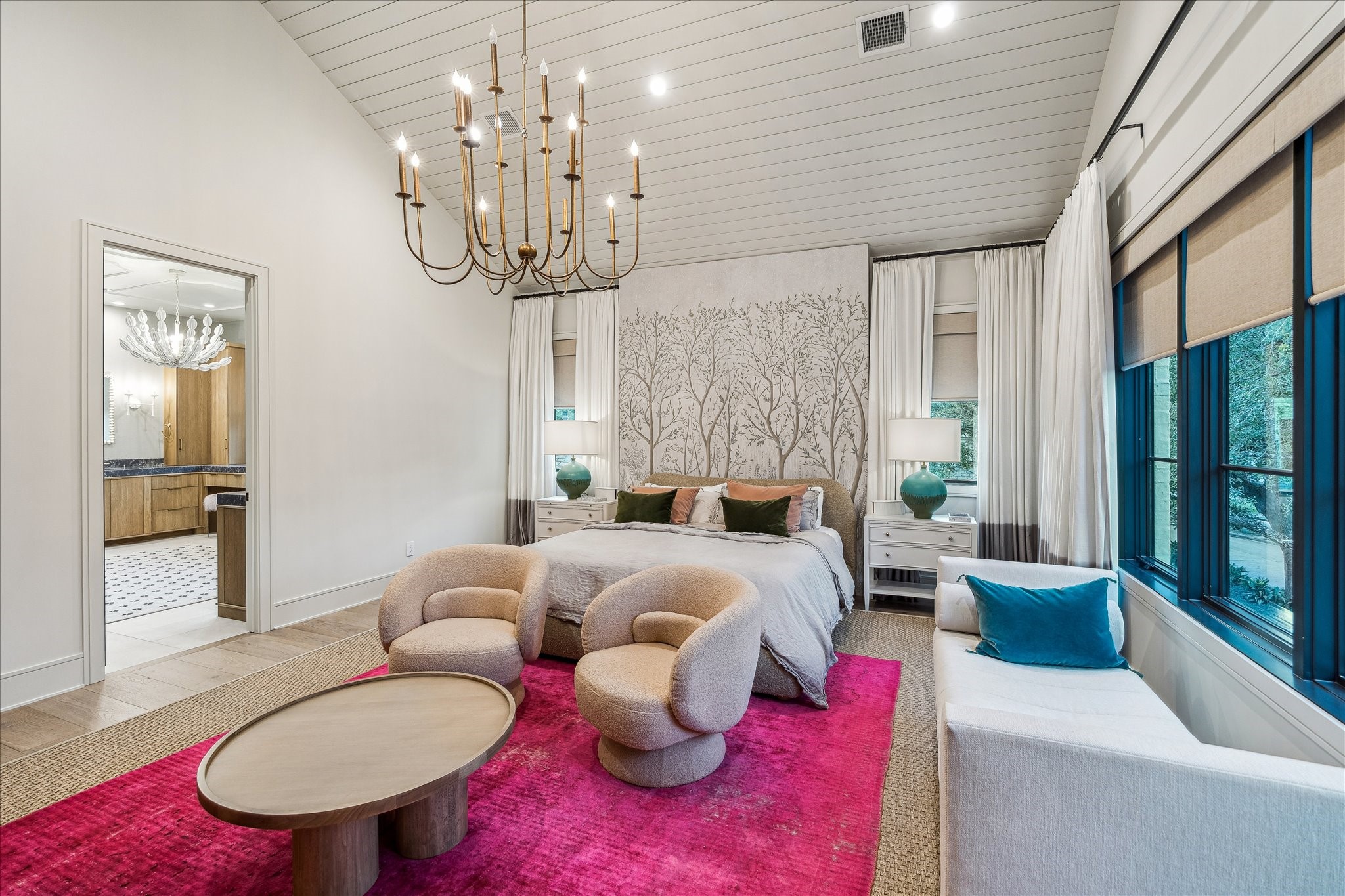 3807 Westerman Street Houston, TX 77005 - Photo 28 of 50 Serene and sophisticated, the primary retreat features vaulted ceilings with wood panel detailing, wide-plank white oak flooring, and a custom painted feature wall—all illuminated by designer lighting and soft natural light.