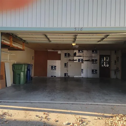 a view of water heater and a garage