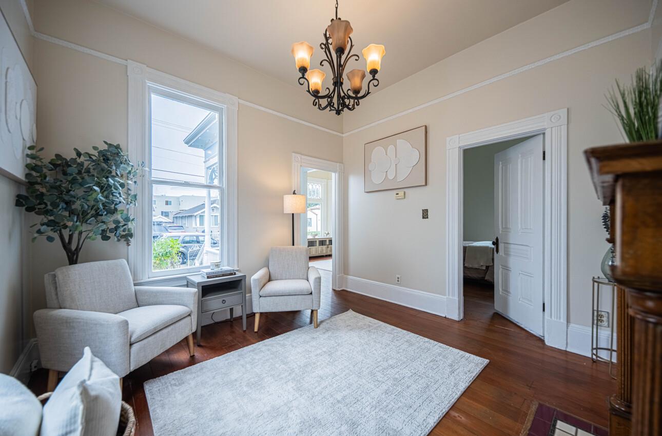 332 Capitol Street Salinas, CA 93901 - Photo 12 of 41 a living room with furniture a chandelier and a window