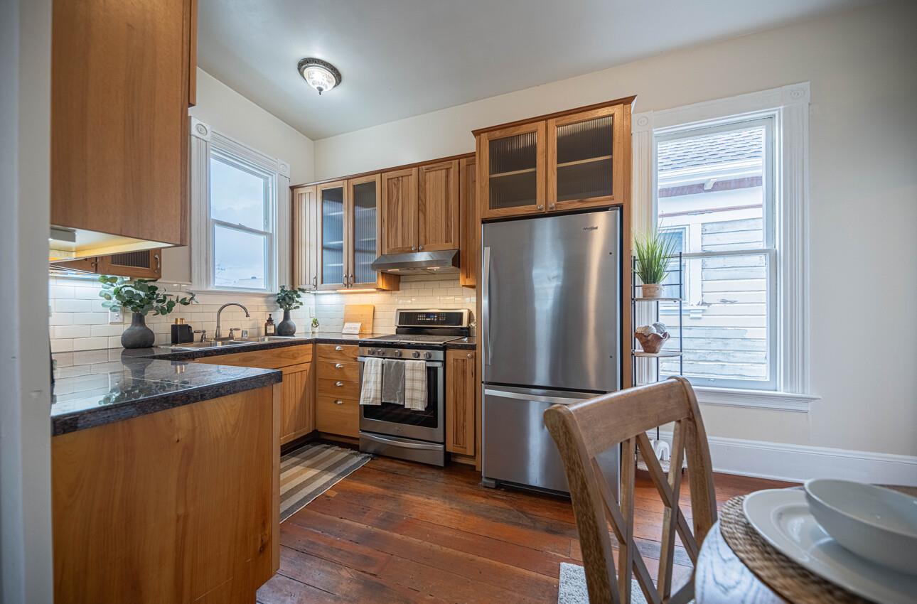 332 Capitol Street Salinas, CA 93901 - Photo 15 of 41 a kitchen with stainless steel appliances granite countertop a refrigerator a stove a sink and dishwasher