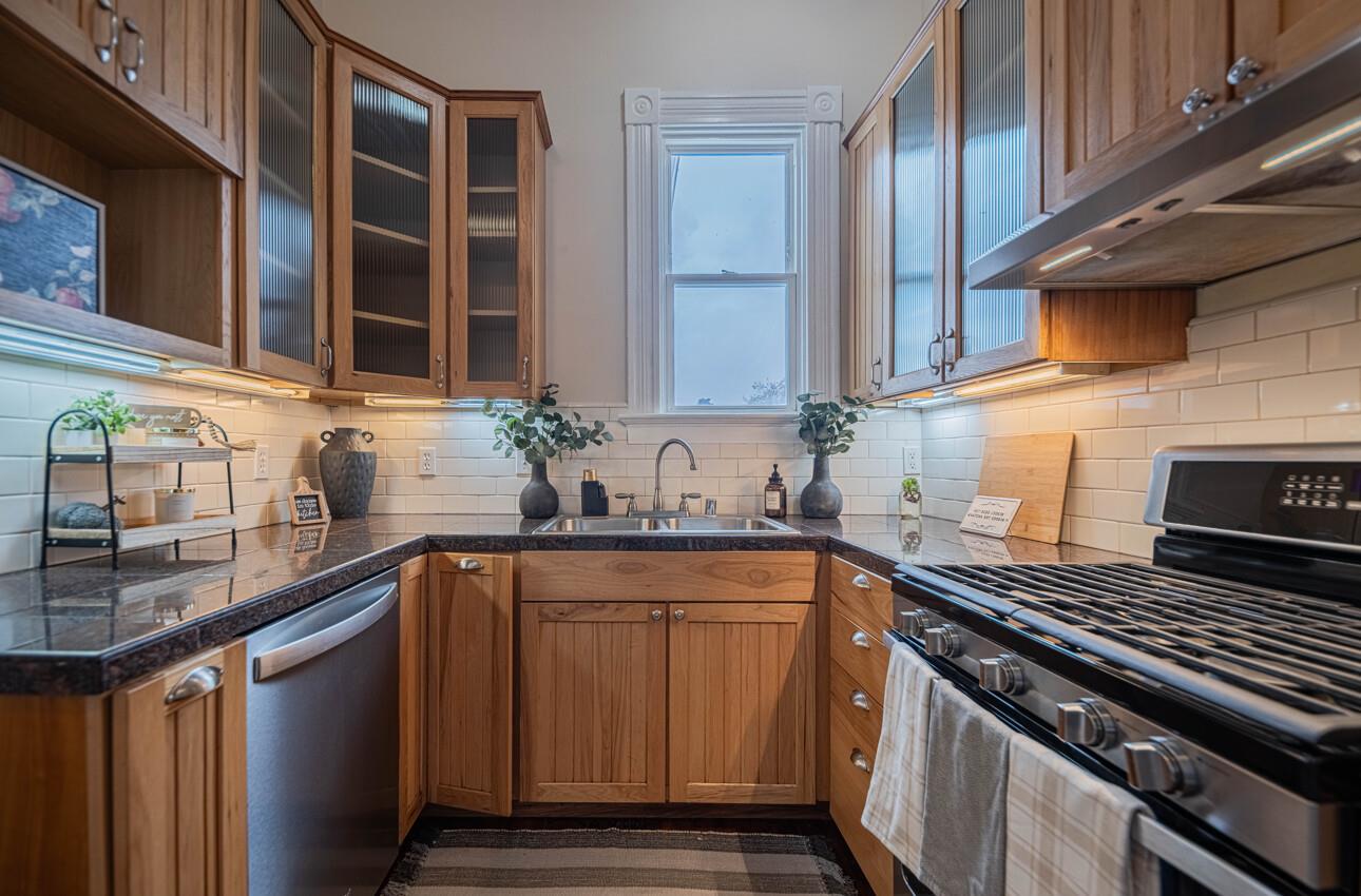 332 Capitol Street Salinas, CA 93901 - Photo 16 of 41 a kitchen with stainless steel appliances a sink stove and cabinets