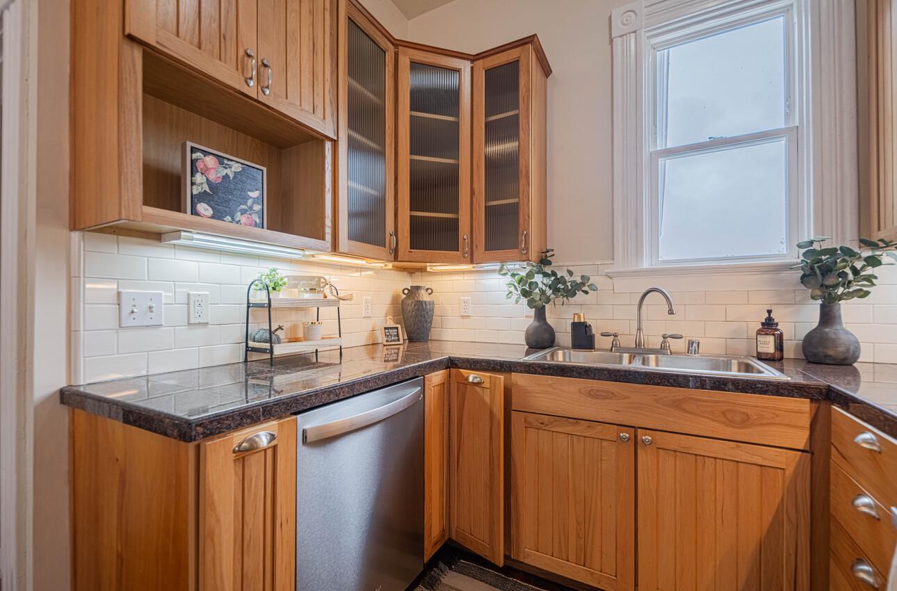332 Capitol Street Salinas, CA 93901 - Photo 17 of 41 a kitchen with stainless steel appliances granite countertop a sink and cabinets