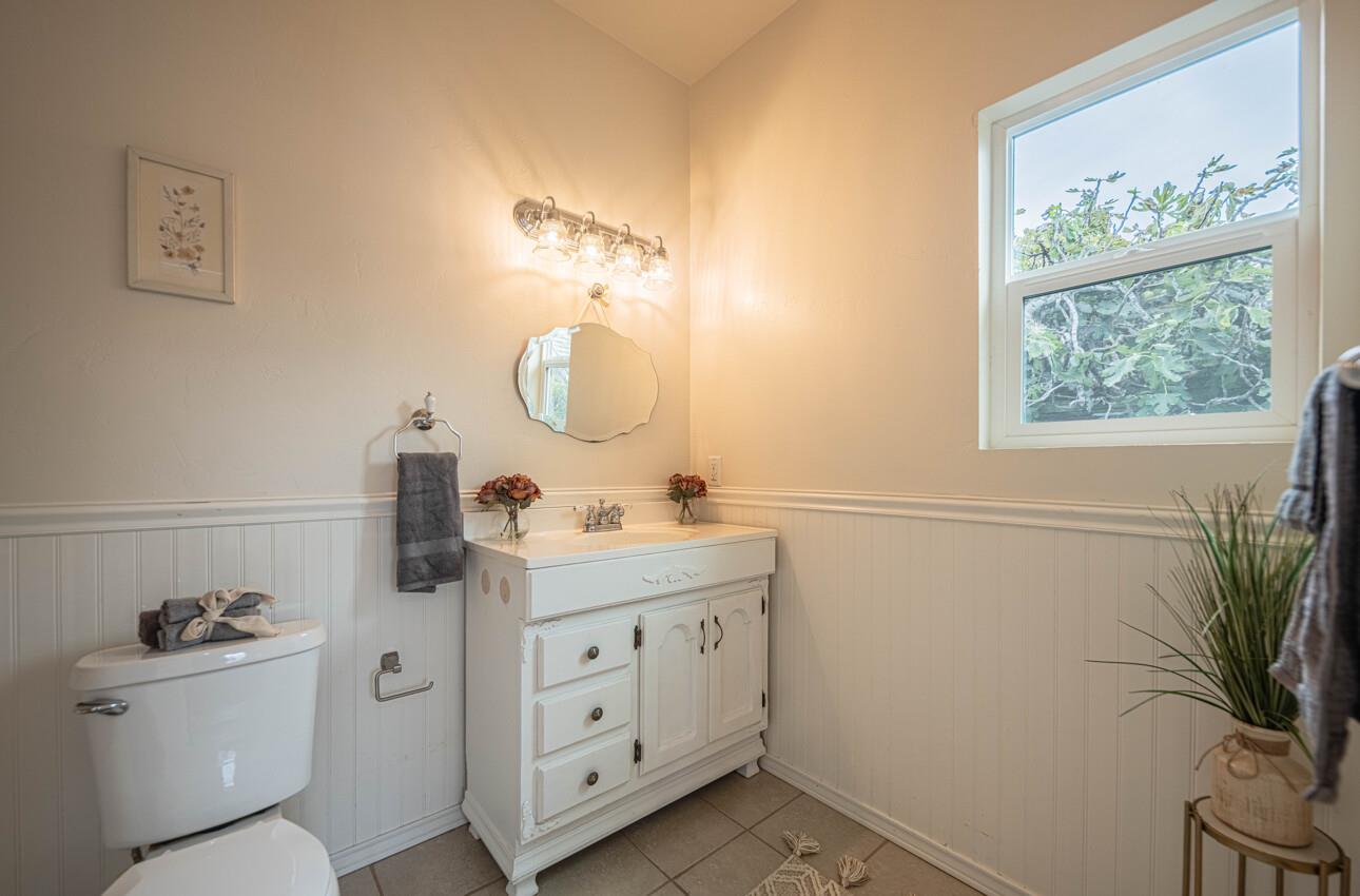 332 Capitol Street Salinas, CA 93901 - Photo 25 of 41 a bathroom with a toilet sink and mirror