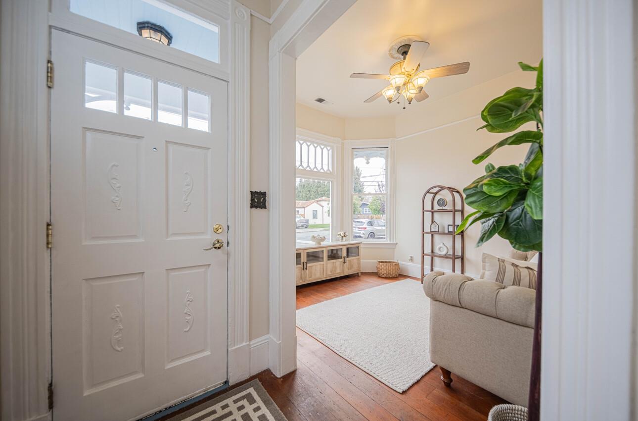 332 Capitol Street Salinas, CA 93901 - Photo 6 of 41 a living room with furniture and a chandelier