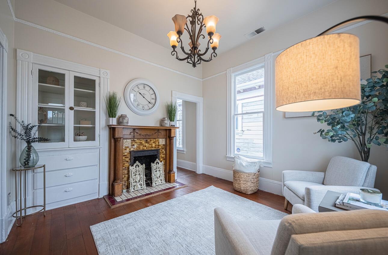 332 Capitol Street Salinas, CA 93901 - Photo 9 of 41 a living room with furniture a fireplace and a large window