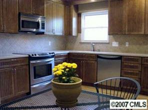 9918 Fairway Ridge Road Charlotte, NC 28277 - Photo 2 of 5 a kitchen with a sink and a stove top oven